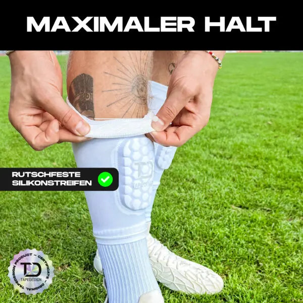 Weiße Tapedesign Schienbeinschoner Sleeve für optimalen Schutz und Komfort beim Sport, detaillierte Nahaufnahme. – Bild 